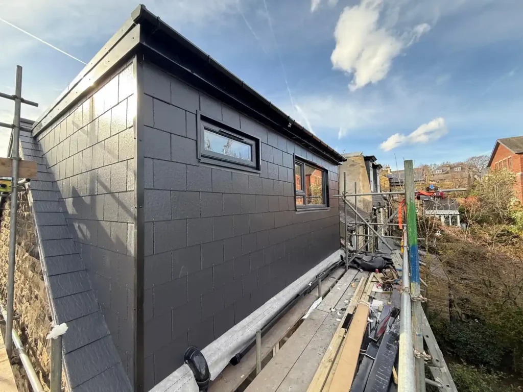 New dormer with slate cladding, casement windows, and roof lights on a Sheffield loft conversion