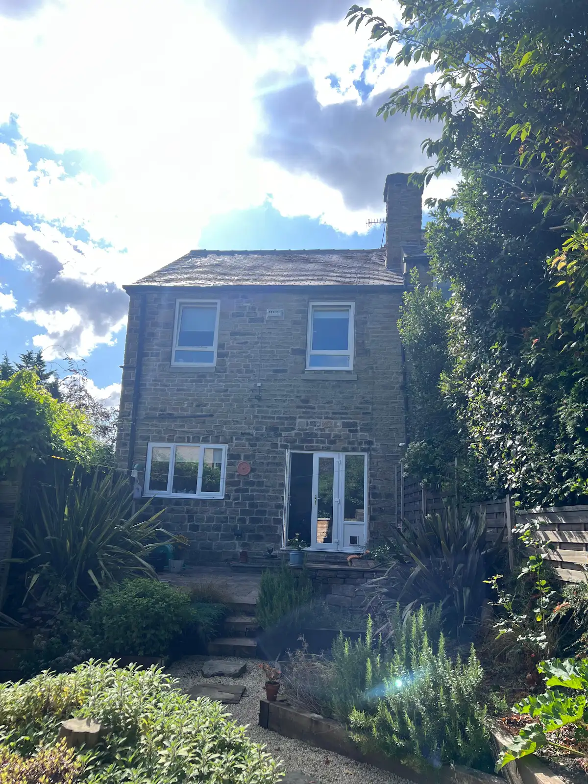 Rear of the stone house before the dormer was added
